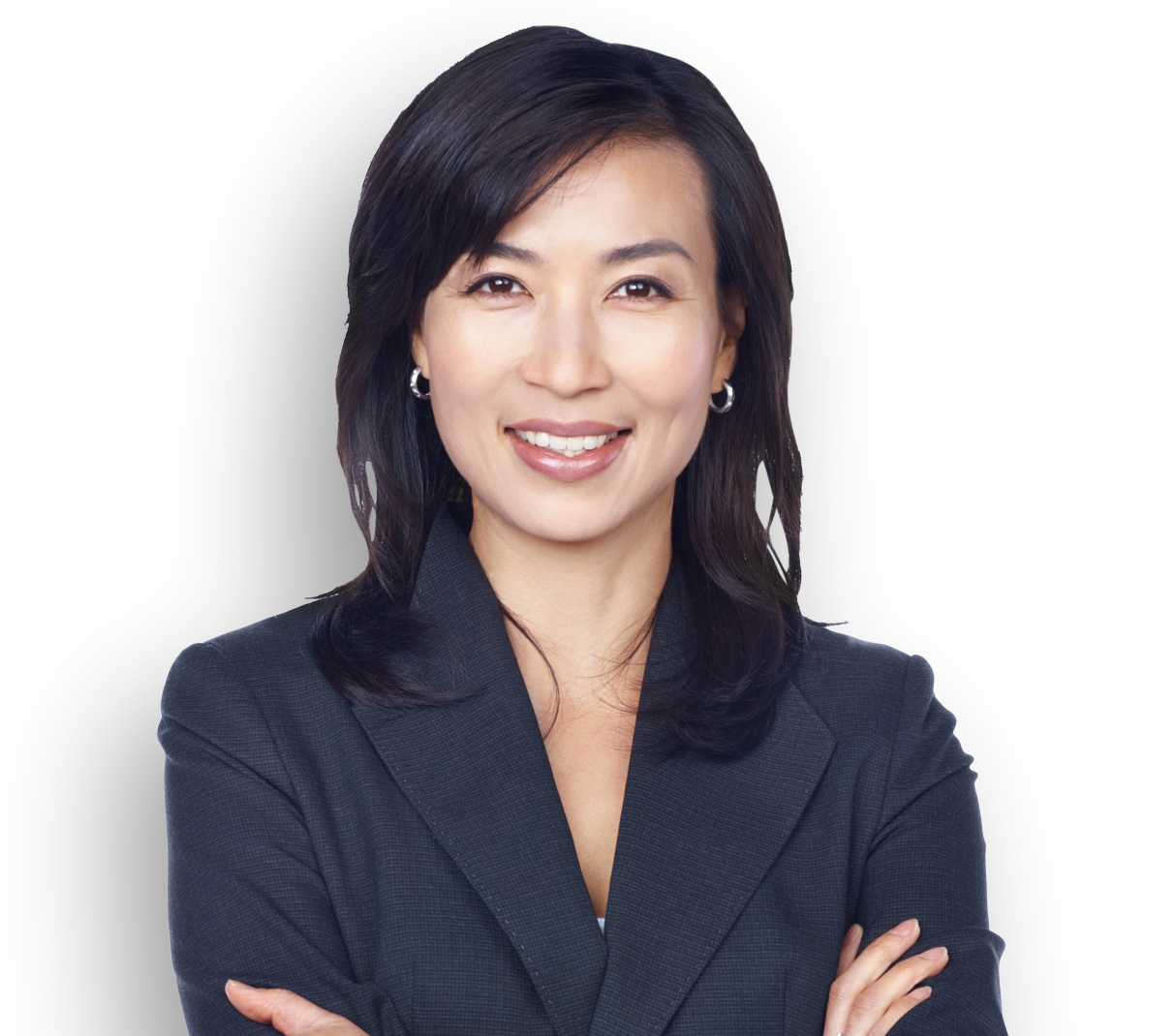 Asian woman smiling with arms folded