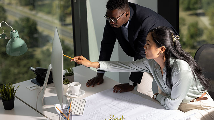 Young colleagues working together in their office